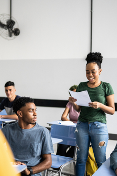 young woman giving presentatino to classmates
