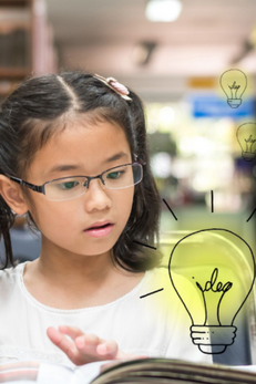 young girl reading book with lightbulb graphic