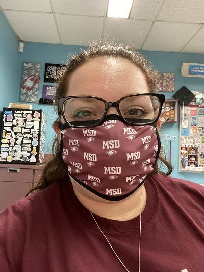 sarah lerner in a mask here in her classroom reflects on emotional trauma